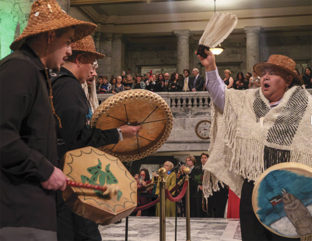 The Squaxin tribe sings, drums and dances inside the Capitol.