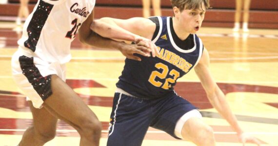 Luke Caputo/Kitsap News Group photos
Bainbridge Spartan Luke Johnson evades a defender in a 47-41 loss to the Franklin Pierce Cardinals Feb. 28 at the University of Puget Sound in Tacoma.