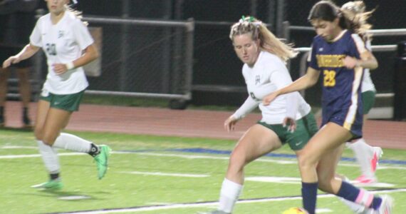 Luke Caputo/Kitsap News Group photos
Spartan Taylor Mass attempts to dribble around a PA defender in a 2-0 Bainbridge home win over the Roughriders Oct. 9.