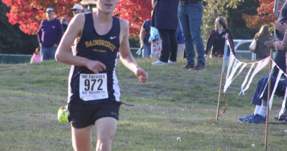 Luke Caputo/Kitsap News Group photos
Spartan Ryan Dodge crosses the finish line in the boys’ 5K event, placing first in the Olympic League Cross Country meet at Battle Point Park on Bainbridge Island Oct. 15.