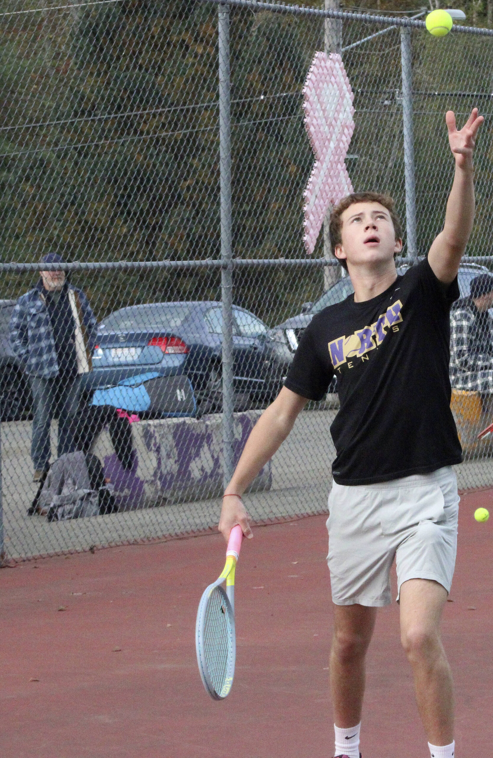 Viking Grady DeVries (serving) and his partner Rocco Targett won the doubles championship at the Olympic League boys’ tennis tournament Oct. 23 at North Kitsap High School.