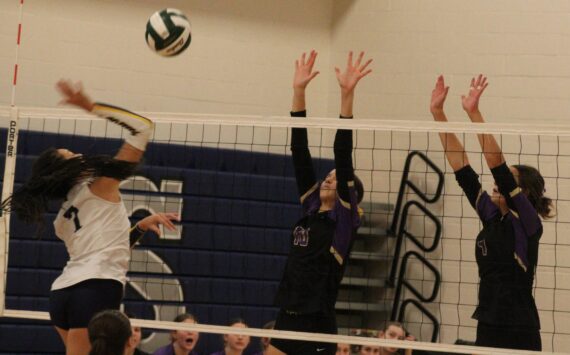 Luke Caputo/Kitsap News Group photos
Vikings Maci Anderson and Addison Jess prepare to block a spike from Spartan Zariyah Francis in a 3-0 Bainbridge win over North Kitsap Nov. 8 in the semifinals of the District 3 2A volleyball tournament at North Mason High School.
