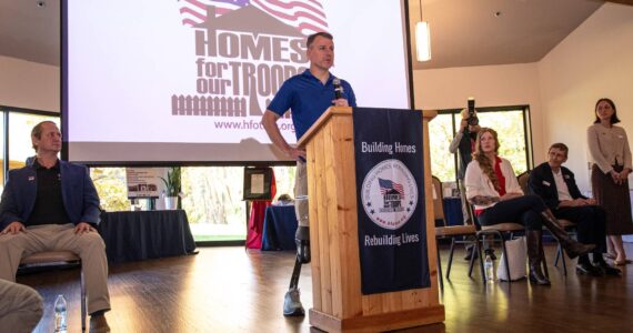 HFOT courtesy photos
Captain Tim Bomke speaks to a crowd of about 120 during the welcoming ceremony Nov. 8 on Bainbridge Island.