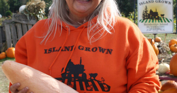 File photo
Shana Wadsworth Ramirez, Suyematsu Farms manager, holds a banana squash.