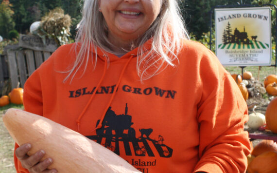 File photo
Shana Wadsworth Ramirez, Suyematsu Farms manager, holds a banana squash.