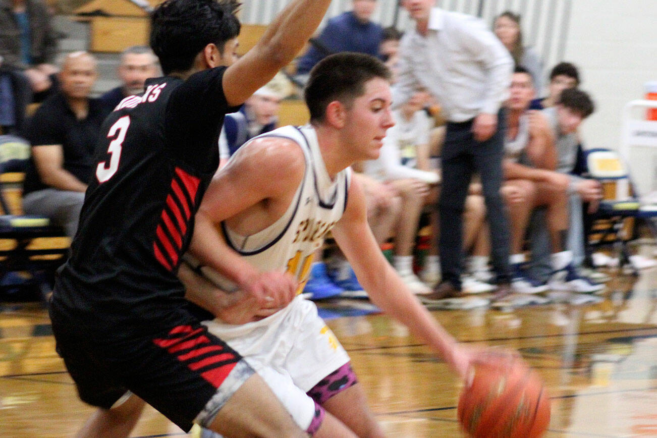 Spartan Ryan Rohrbacher drives to the hoop in a 64-58 Bainbridge home win against Palm Springs Dec. 3.