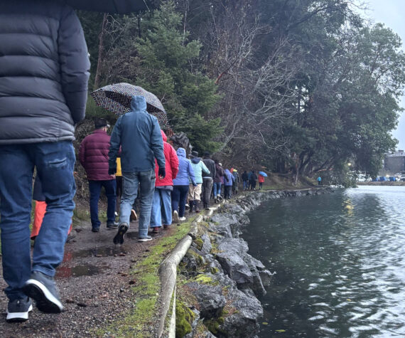 Molly Hetherwick/Kitsap News Group photos
King tide walk attendees stroll along the Waterfront Trail Dec. 8, next to an unusually high water level.