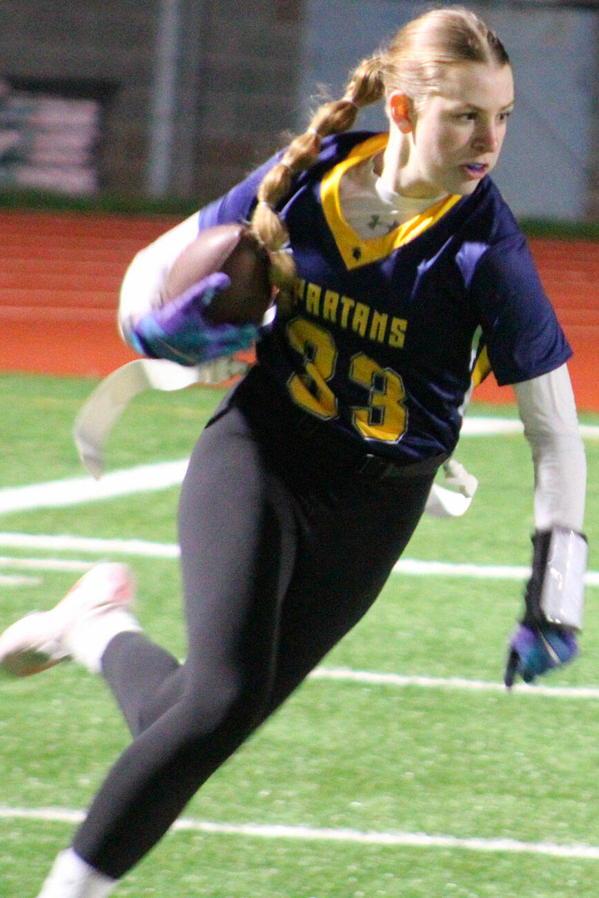 Spartan slot receiver Magnolia Reynolds tries to get past a defender in a 21-7 home loss to Klahowya Jan. 15.