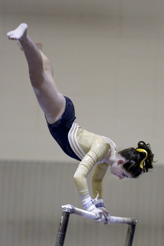 Rachel Kaminer competes on the bars last Friday. See the Review website for a photo slideshow.
