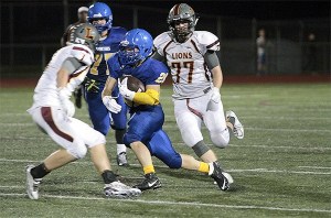 Spartan superstar BHS junior Eric Jung dodges around some Lakeside defenders in Friday’s home game