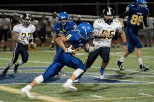 BHS senior running back Ben Fisher dashes through the defensive efforts of Everett during Friday’s game.