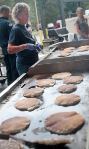 Dorothy Callahan works the grill at the Bainbridge Island Fire Department volunteer pancake breakfast. Callahan has volunteered at every single pancake breakfast