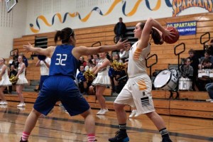 BHS senior post Kayla Buchmeier looks for a teammate to pass to early in the game.