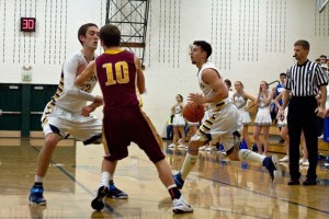 Spartan senior Daniel Locascio makes a break around the defensive efforts of the visiting Kingston High during Saturday night's home game