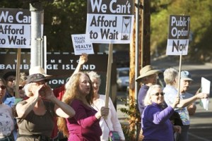 About 50 island residents demonstrated their support for health care reform Wednesday evening on Winslow Way.