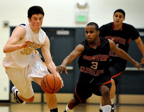 Spartan forward Ryan Burris drives past a Cleveland defender Tuesday. Burris finished the night with 17 points.