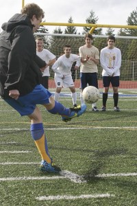 (L-R) As Alex Winship takes the free kick