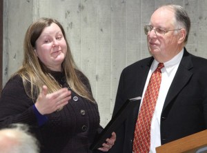 Bainbridge Island City Councilwoman Sarah Blossom thanks Steven Bonkowski while presenting the outgoing councilman with a plaque in appreciation of his city service.
