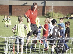 Erik Oman meets with young Bainbridge Island Football Club players during the coach’s visit to Bainbridge Island.