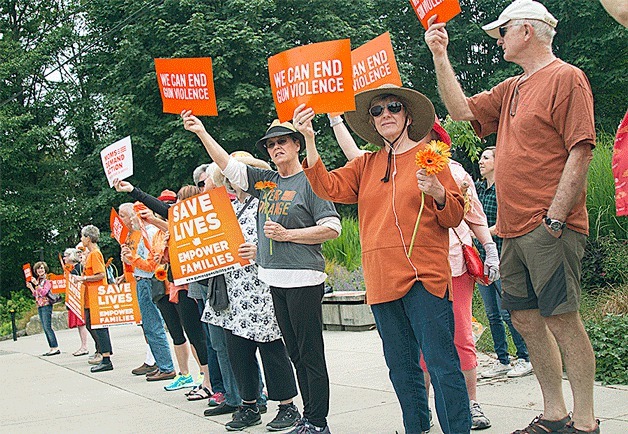 A Wear Orange demonstration in downtown Winslow last week invited islanders to consider the costs of gun violence.