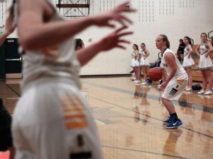 Bainbridge’s senior guard Paige Brigham looks to pass the ball during last week’s home game against Port Angeles. Brigham finished the game with eight total points scored.