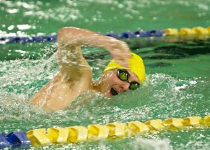 Bainbridge swimmer Keenan Grant competes in the varsity heat of the Boys 200 Yard Freestyle event during the first swim meet of the season against Central Kitsap High at the Bainbridge Aquatic Center Thursday