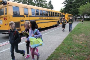 Students arrive at Ordway Elementary for the start of school on Wednesday.