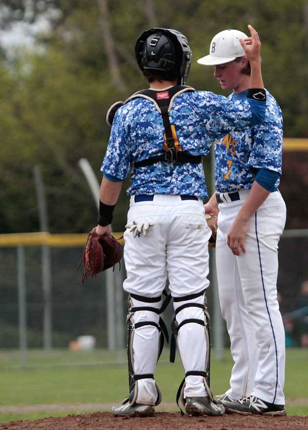 Duncan McCombs gets a little advice before facing the next Bishop Blanchet batter during the Spartans' 2-0 shutout last week.