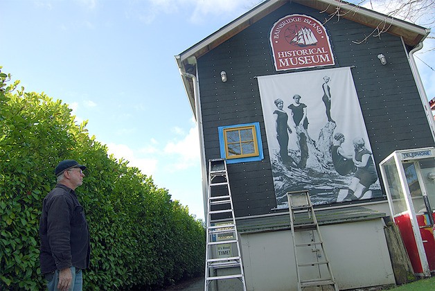 Bainbridge Island Historical Museum Curator Rick Chandler looks at the construction work on the outside of the museum. The museum renovations will be finished shortly.