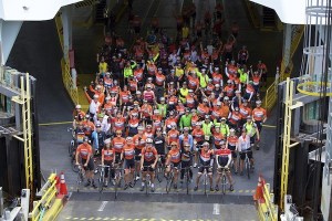 Obliteride riders depart the ferry on Bainbridge Ferry during the cancer research fundraiser.