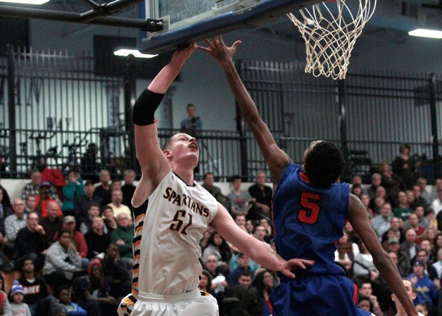 Bainbridge junior wing/post Oskar Dieterich jumps for a basket