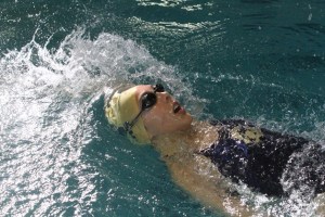 The Spartans’ Julia Brooks competes in the 200-yard medley relay in last week’s home meet against defending state champions Lakeside.
