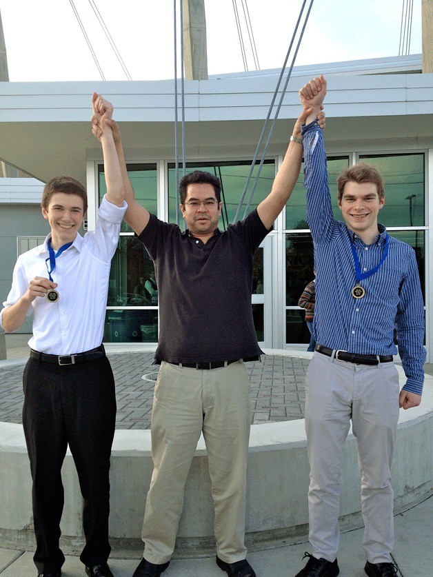 Nick Stahl and Zack Badzik stand with music instructor Dave Carson after winning their divisions at the Washington State Music Educators Association State Championship in Ellensburg. Stahl was tops in the soprano/alto sax division and Badzik took first in the tenor/baritone sax division.