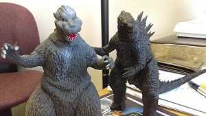The two Godzilla action figures which sit on Review staffer Luciano Marano's desk - one the classic 1954 version