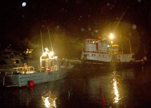 The 100-year-old wood tugboat 'Chickamauga' is towed from Eagle Harbor the morning of Jan. 31.