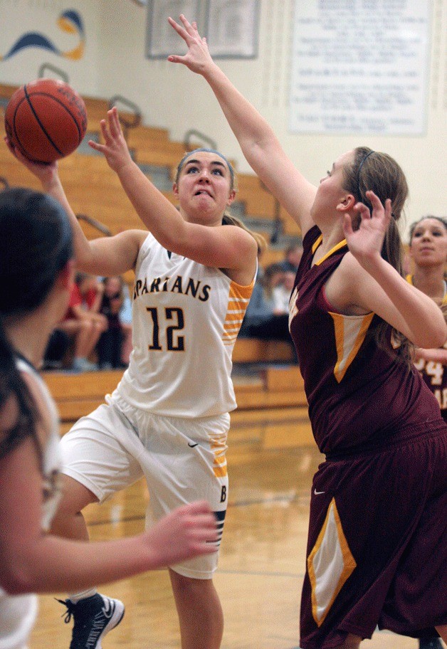 The Spartans' Katie Useliss hoists a shot during Bainbridge's first home game against South Kitsap. BHS won 62-59 in a thriller.