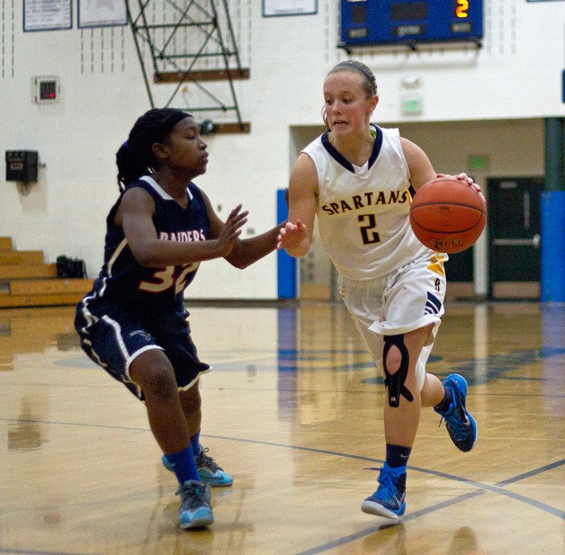 BHS senior guard Paige Brigham drives towards the hoop during Wednesday's home game against Nathan Hale. The Spartans easily outplayed the visitors