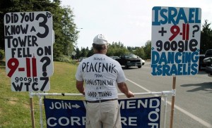 Robin Hordon from Kingston tries to catch the eye of drivers on Highway 305.