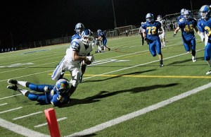 Spartan defensive back Duncan McCombs tries to stop the first Seattle Prep touchdown during the Bainbridge homecoming football game Friday