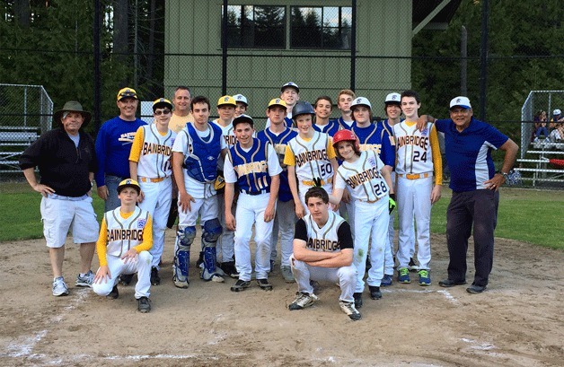 The Bainbridge Blues gather around their championship trophy after edging the Bainbridge Gold 7-6 in the title game.