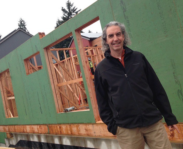 Island architect Jonathan Davis stands in the emerging Grow Community that he was largely awarded the Environmental Innovator Award by the Association of Washington Business.