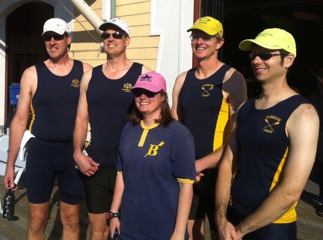Bainbridge Island Rowing’s crew gather for a photo after their strong finish in the 2013 Head of the Charles Regatta. In front