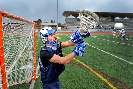 Lacrosse goaltender Julian Skotheim practices some blocks during practice Monday at Bainbridge High School. Skotheim has 44 saves on the season