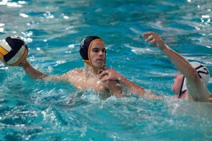 BHS junior driver and co-team captain Douglas Ortyn fends off the defensive efforts of a Gig Harbor player during last week’s home match.