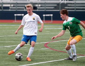 Spartan junior Jake Prodzinski works his way around a Bishop Blanchet defender during last week’s home match.