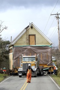 There wasn’t a lot of wiggle room for this 112-year-old house as the Nickel Bros. movers navigate down Oddfellows Road at the beginning of the house’s trip to its new home on Old Mill Road. The trip took several hours Thursday