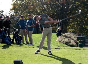 Andy Becker tees off at the first hole of last Thursday's home match against Seattle Prep. The Spartans went on to win 150-117 and advance their season record to 9-1.