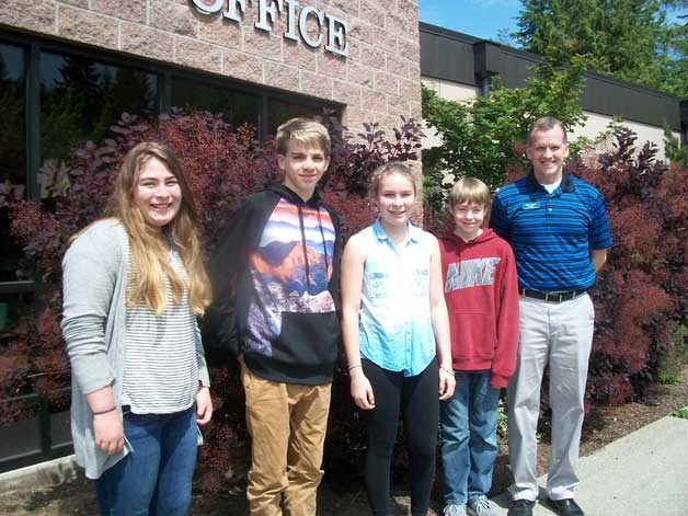 WMS Principal Mike Florian stands with Students of the Month for May: Michael Nelson