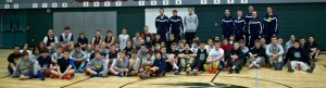 Presents donated by Roots players were gathered and organized by recipient families in the Woodward Middle School gymnasium Monday