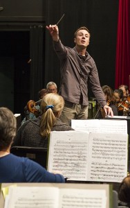 Bainbridge Symphony Orchestra conductor Wesley Shulz leads the group through a recent practice session in preparation for their season opener concert event Saturday
